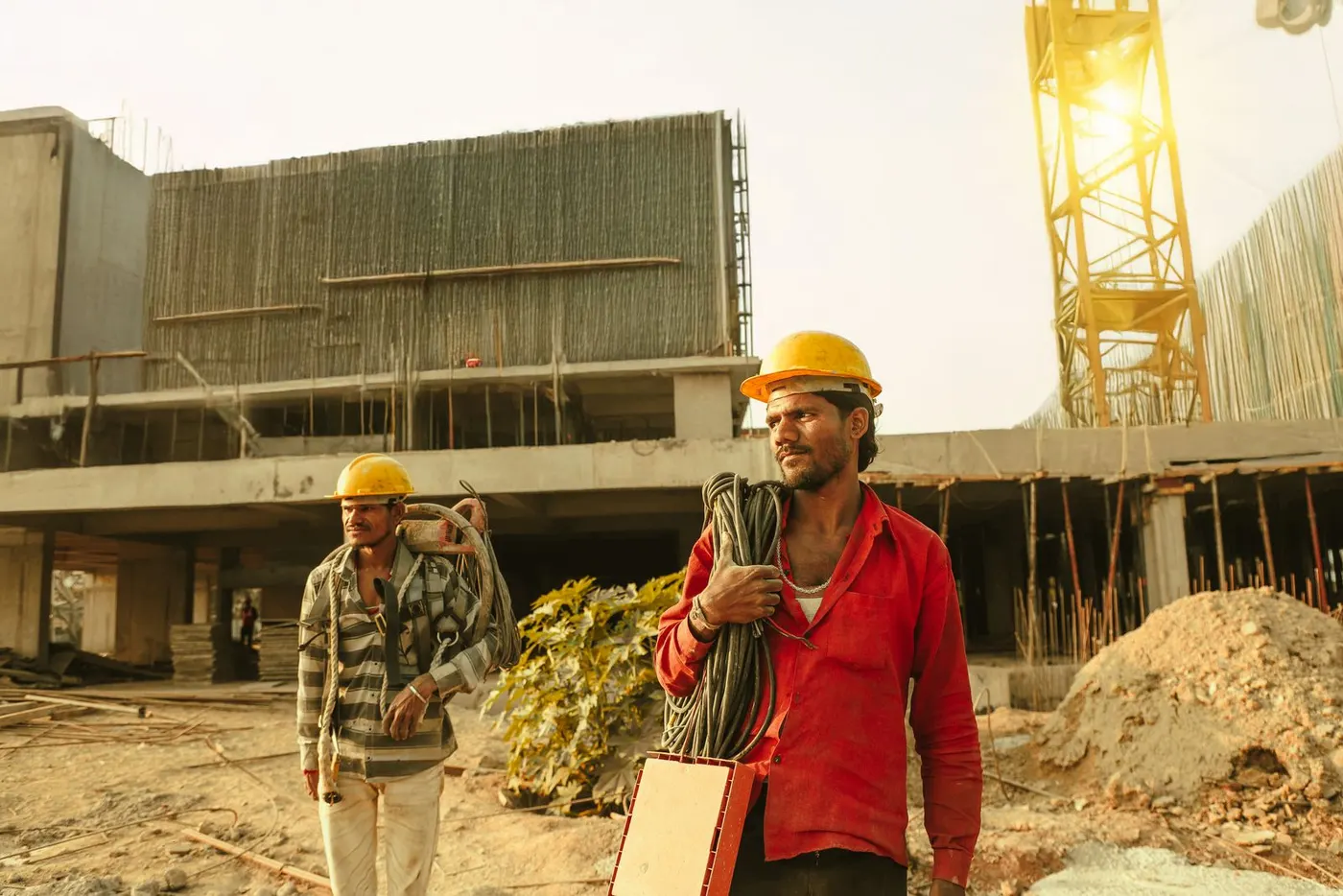 Two contractors walking a commercial job site
